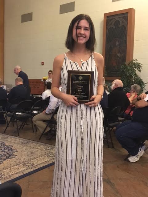 Samantha Simms receiving Knights of Columbus Award